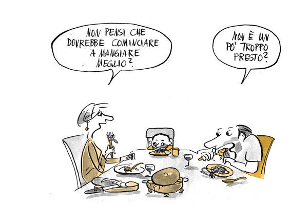 La famiglia mangia a tavola